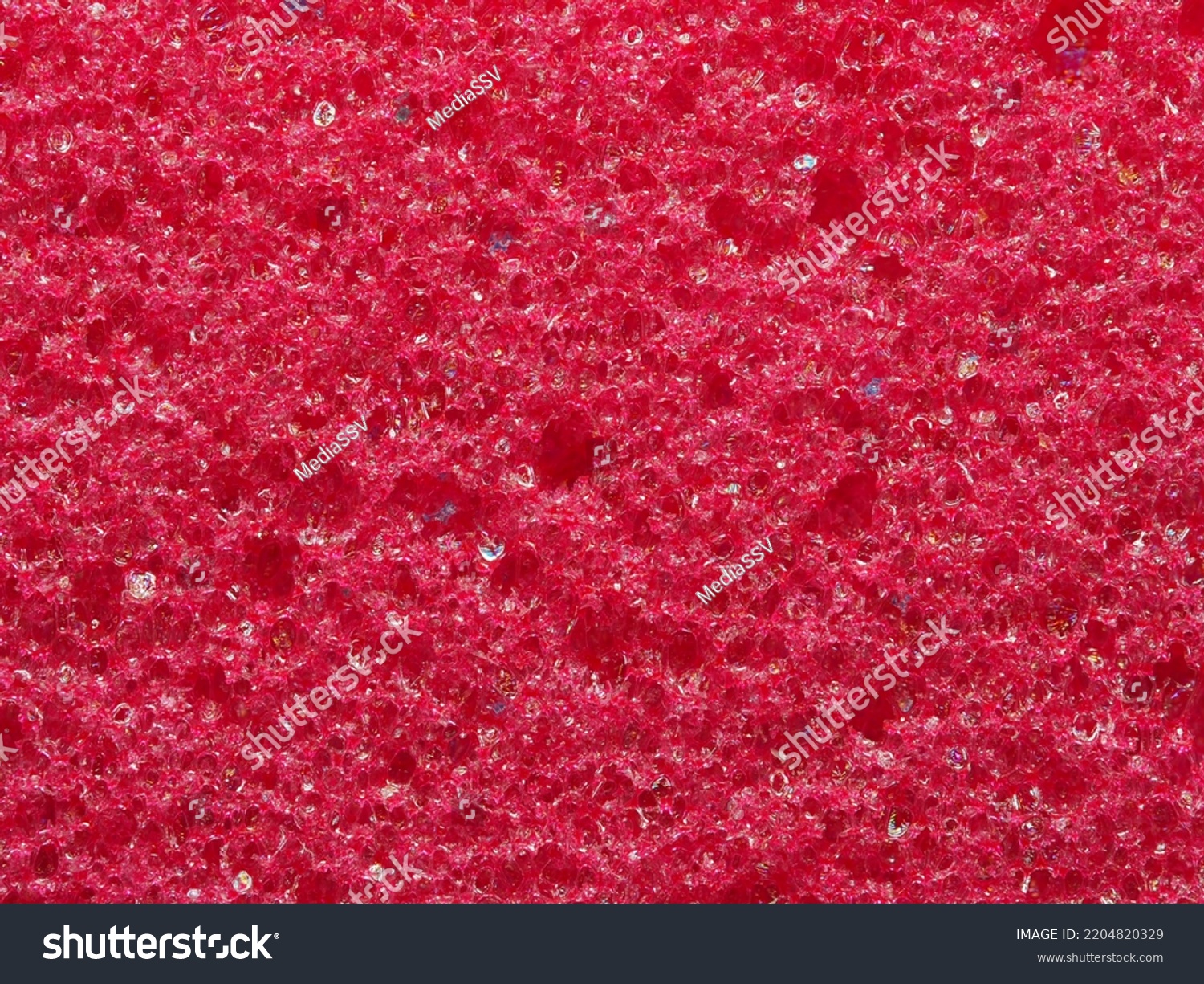 close-up, background, texture, large horizontal banner. heterogeneous surface fine pore structure bright saturated red pumice stone for finger care. full depth of field. high resolution photo #2204820329