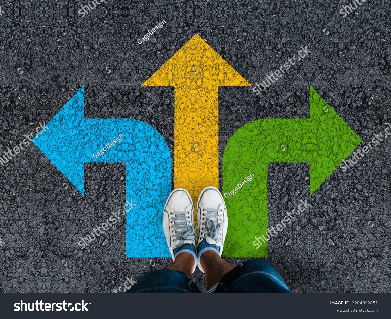  man legs in sneakers standing on road with three direction arrow choices, left, right or move forward  #2204992851