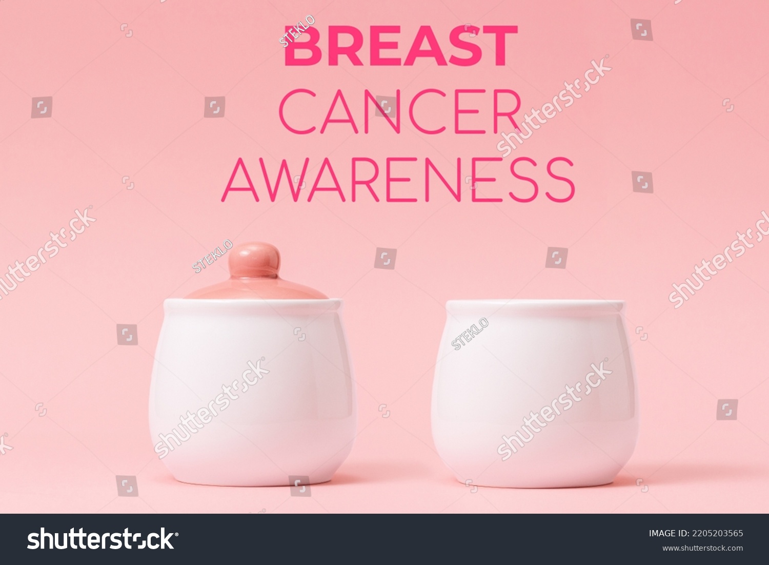 Two white porcelain pots with a pink lid on a pink background. Right side pot without lid, symbolizing the disease. Concept of Breast Cancer Awareness Month. #2205203565