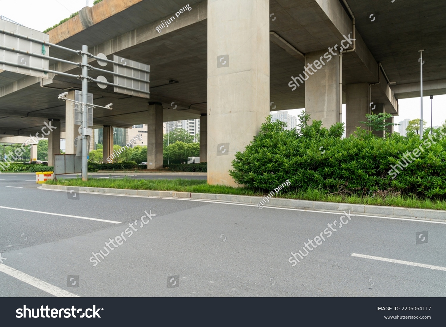 Concrete structure and asphalt road space under the overpass in the city #2206064117