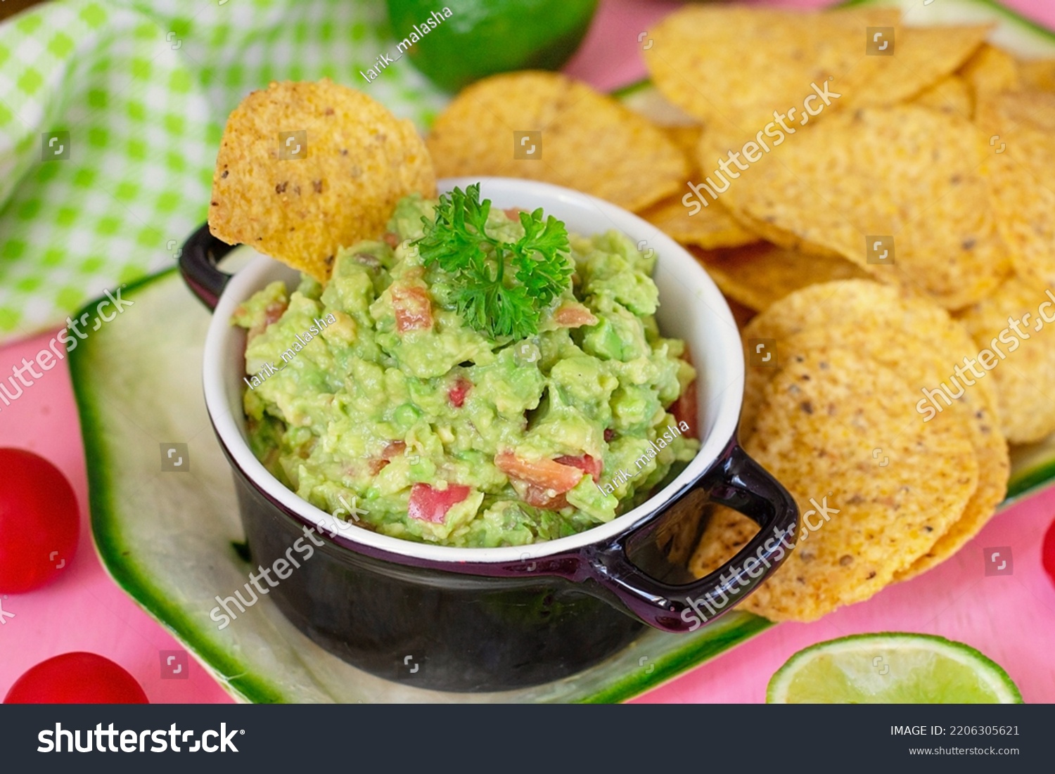Traditional Mexican avocado salad dip Guacamole served with tortilla chips #2206305621