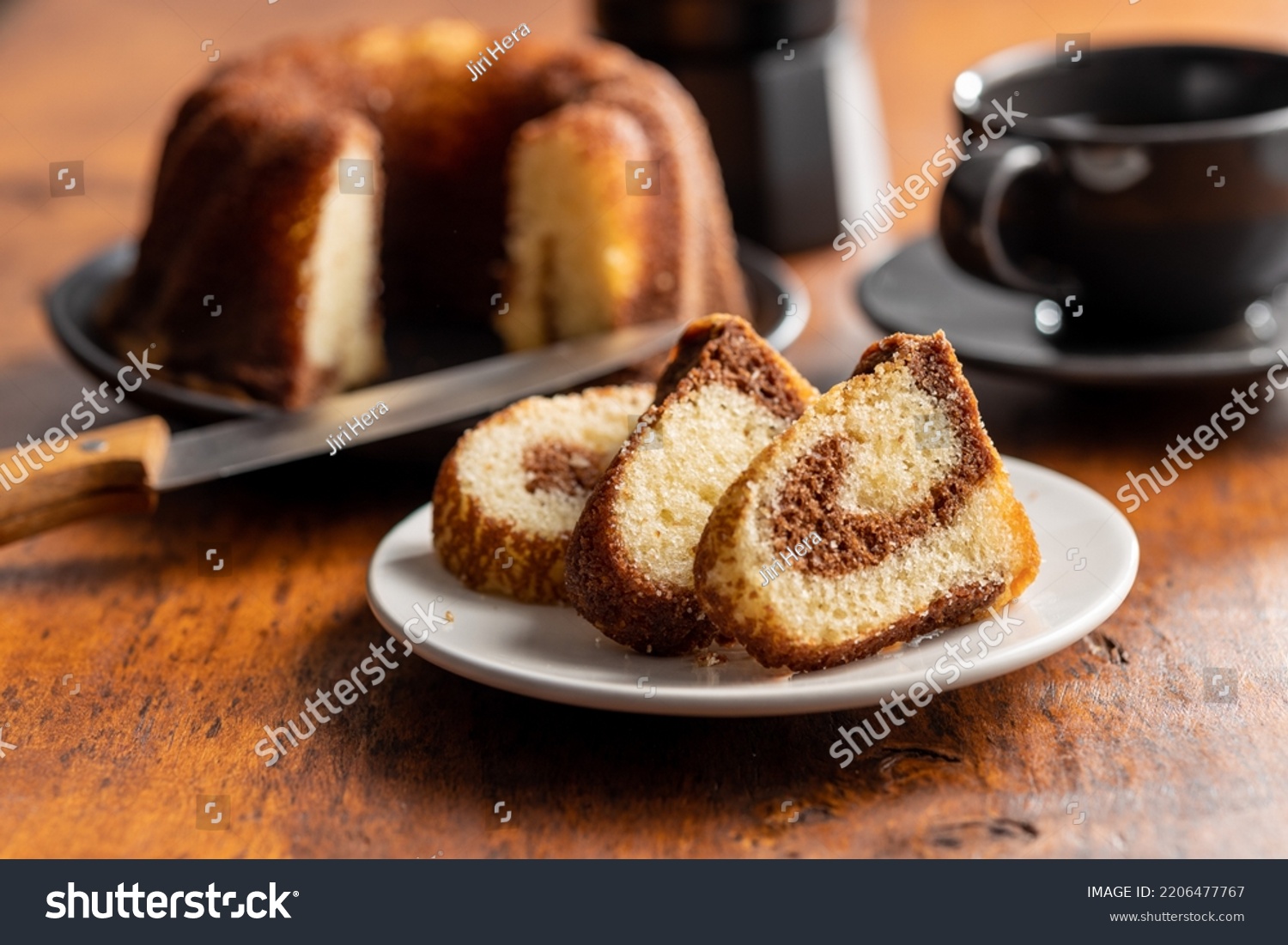 Sweet sponge cake. Bundt cake on the wooden table. #2206477767