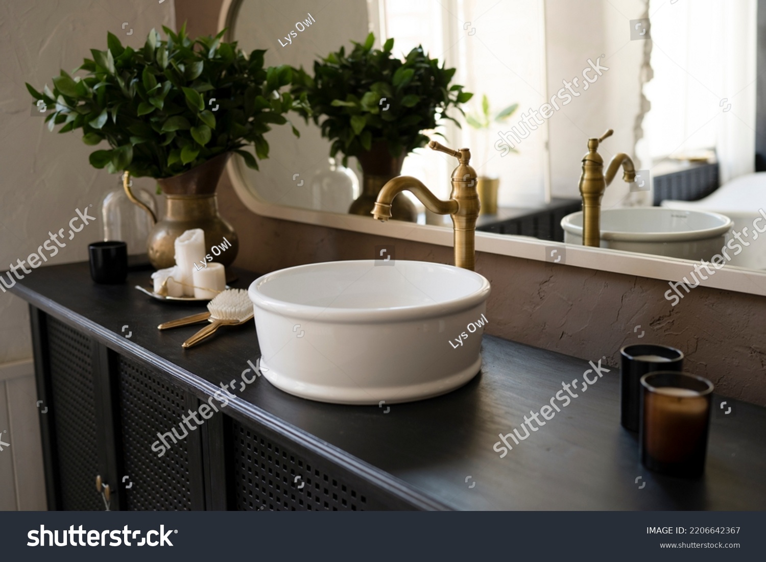 Bathroom interior sink on wooden countertop #2206642367