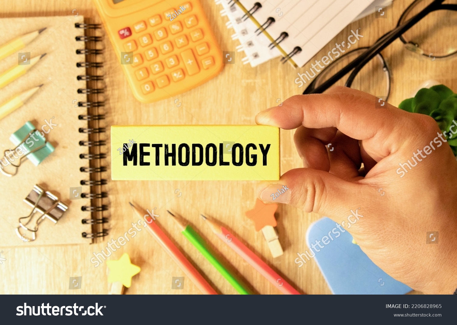 The word methodology written on a notebook on business office desktop. System of methods used in a study or activity concept. #2206828965