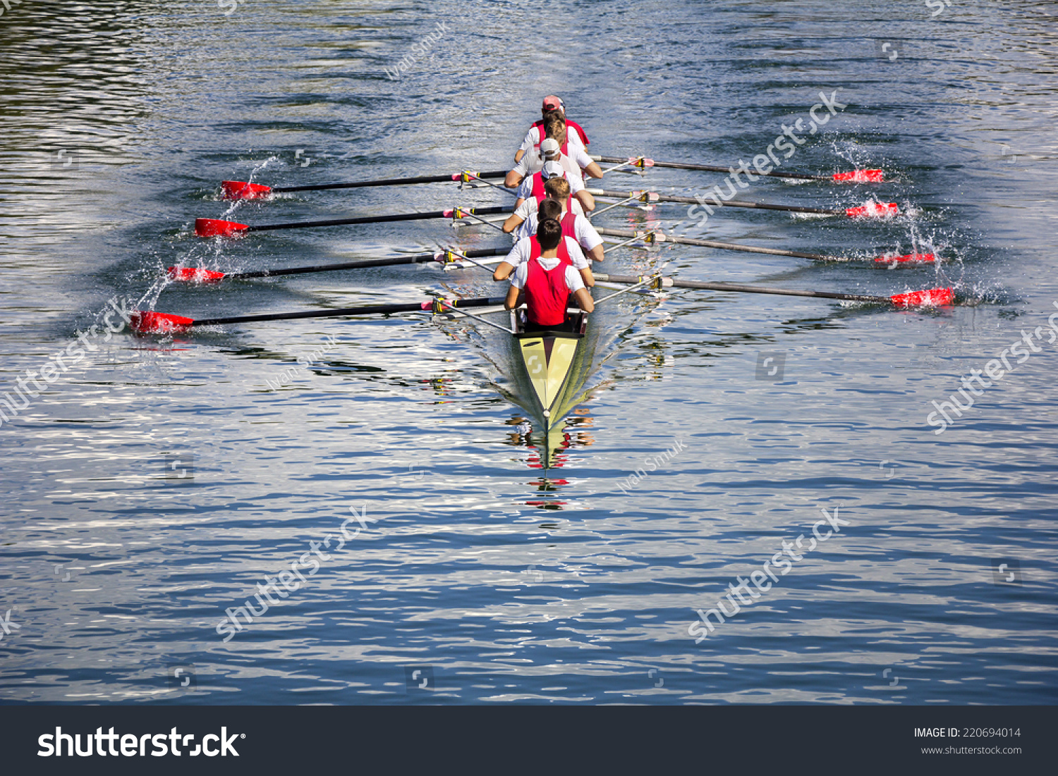 Rowers in eight-oar rowing boats on the tranquil lake #220694014