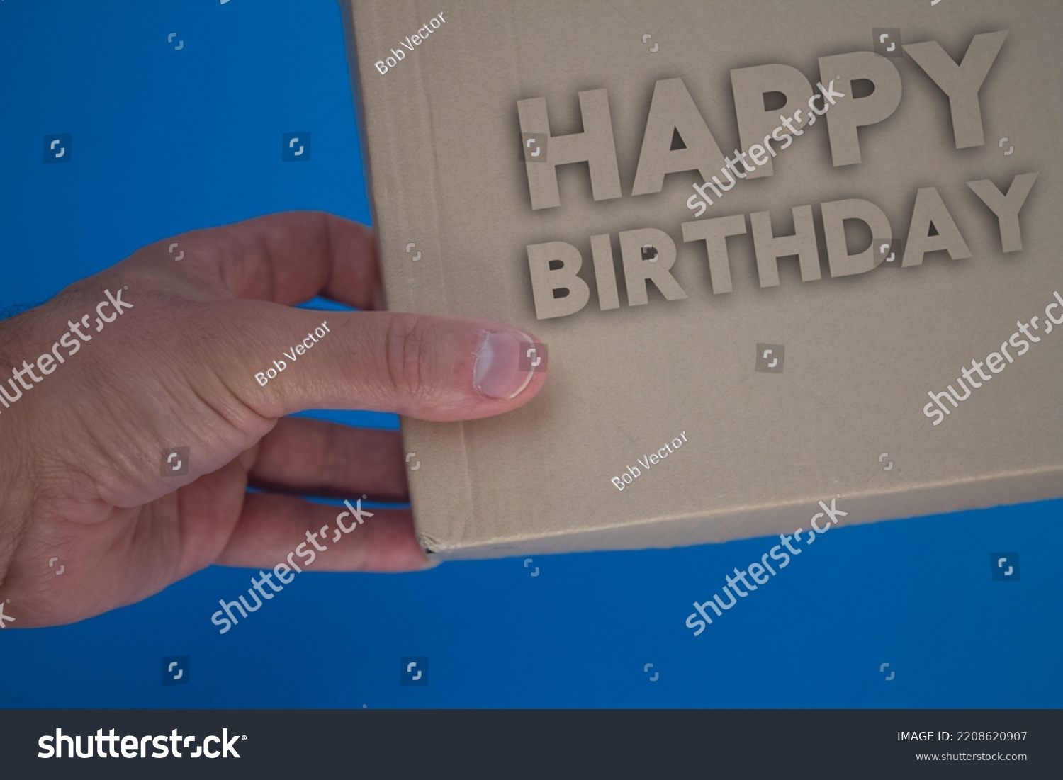 Happy Birthday word with cardboard box. Brown folded card box. #2208620907