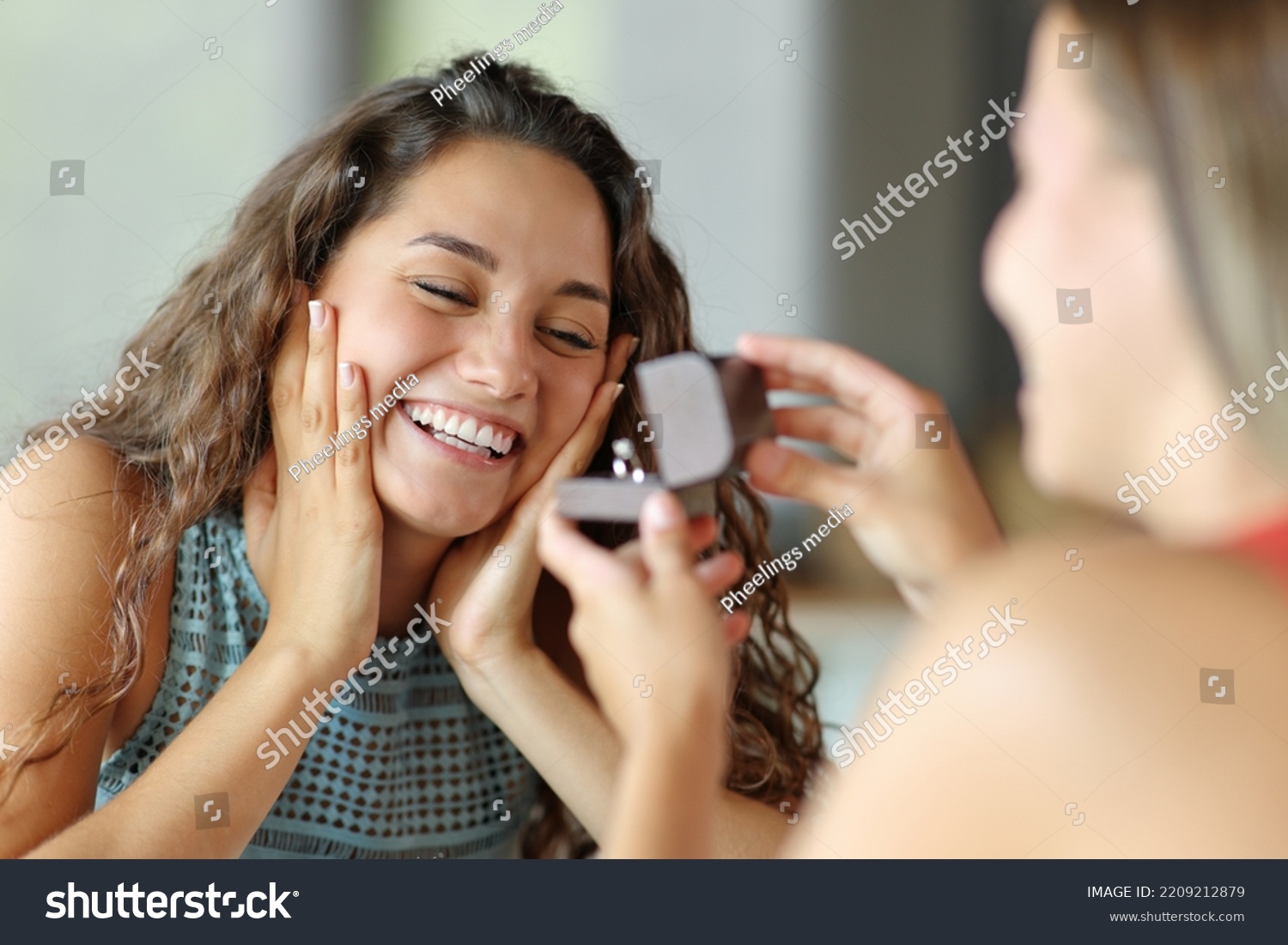 Happy lesbian woman in a marriage proposal accepting engagement #2209212879