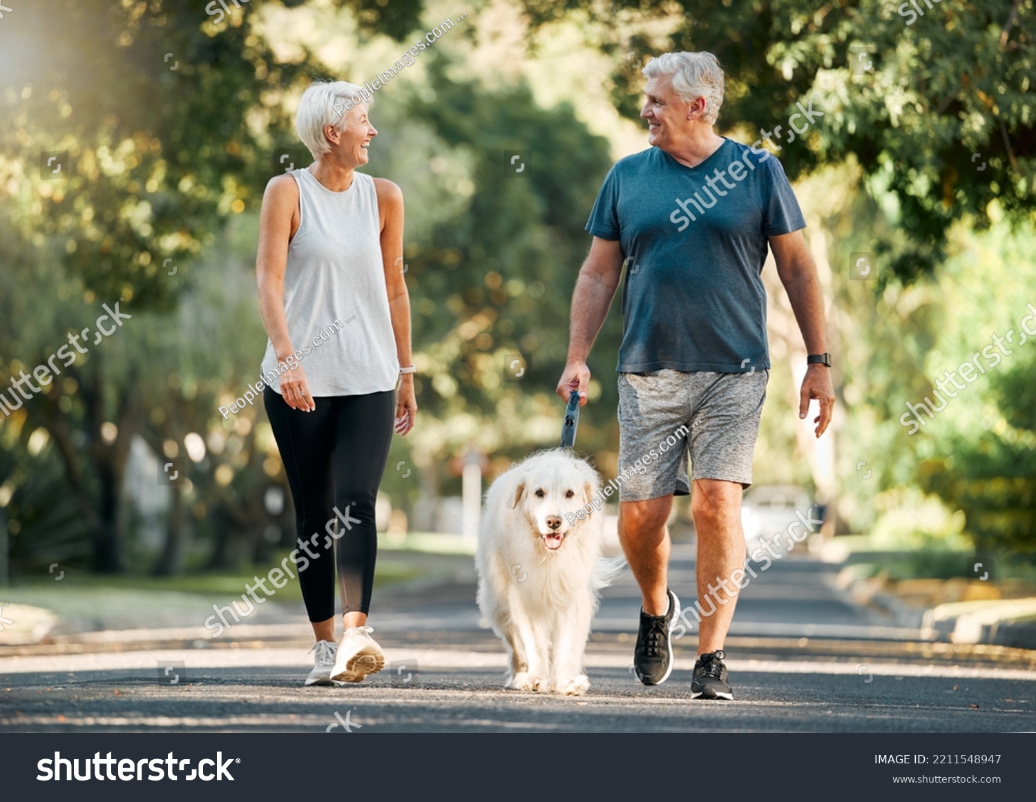 Retirement, fitness and walking with dog and couple in neighborhood park for relax, health and sports workout. Love, wellness and pet with old man and senior woman in outdoor morning walk together #2211548947