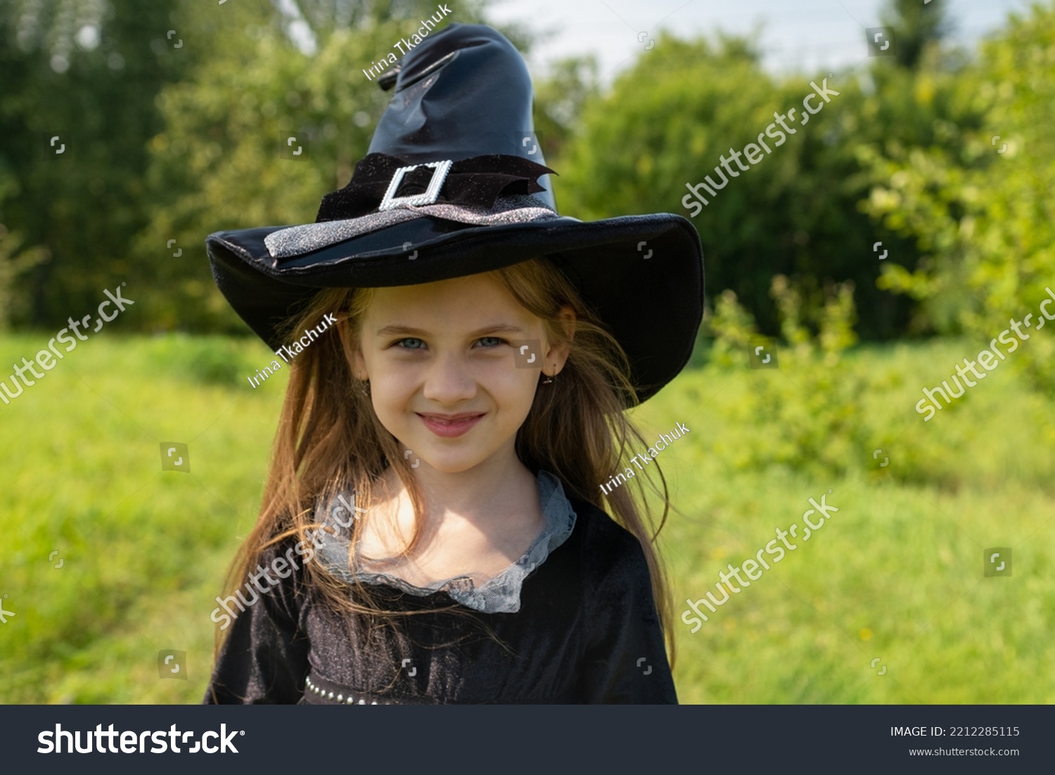 Halloween girl going to collect candy. Trick-or-treating. Guising. Jack-o-lantern. Child in carnival costume witch outdoors. Celebrate halloween. Girl in forest smiling and holding basket of sweets. #2212285115