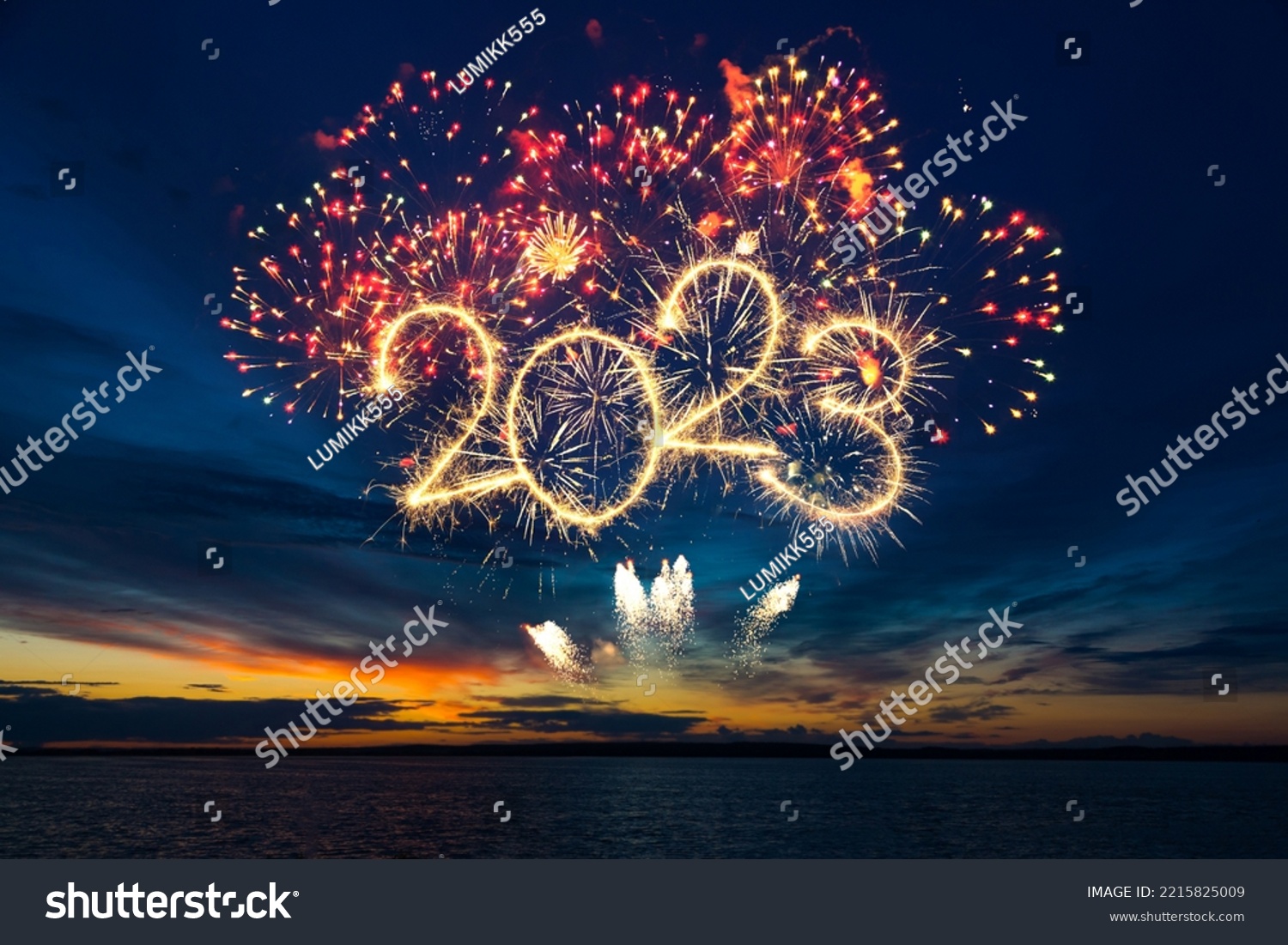 Happy New Year 2023. Beautiful creative holiday web banner or flyer with red fireworks and Golden sparkling number 2023 on blue sky  over sea #2215825009