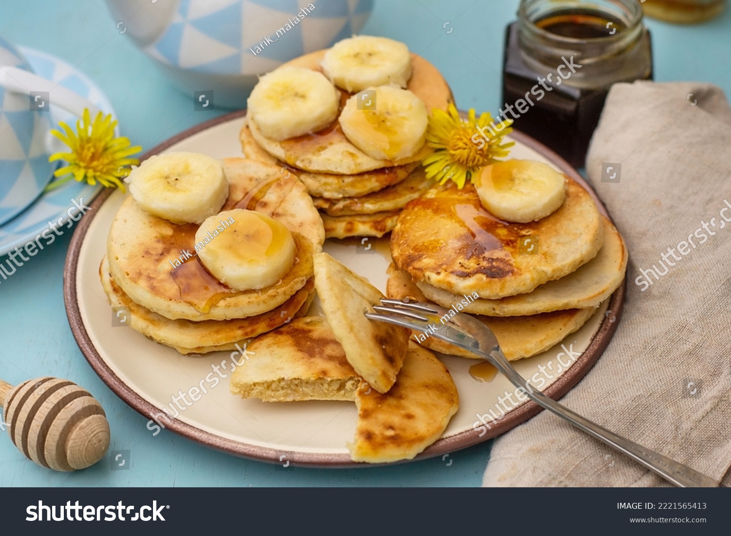 Icelandic traditional oatmeal pancakes Lummur with bananas and honey #2221565413