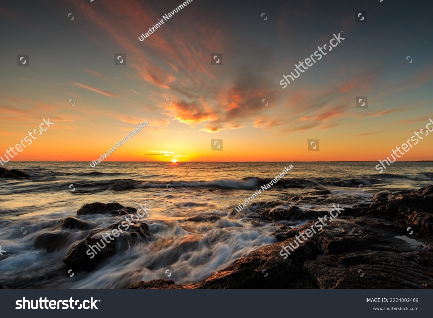 Rocky shore of the Atlantic Ocean at high tide at sunset #2224002469