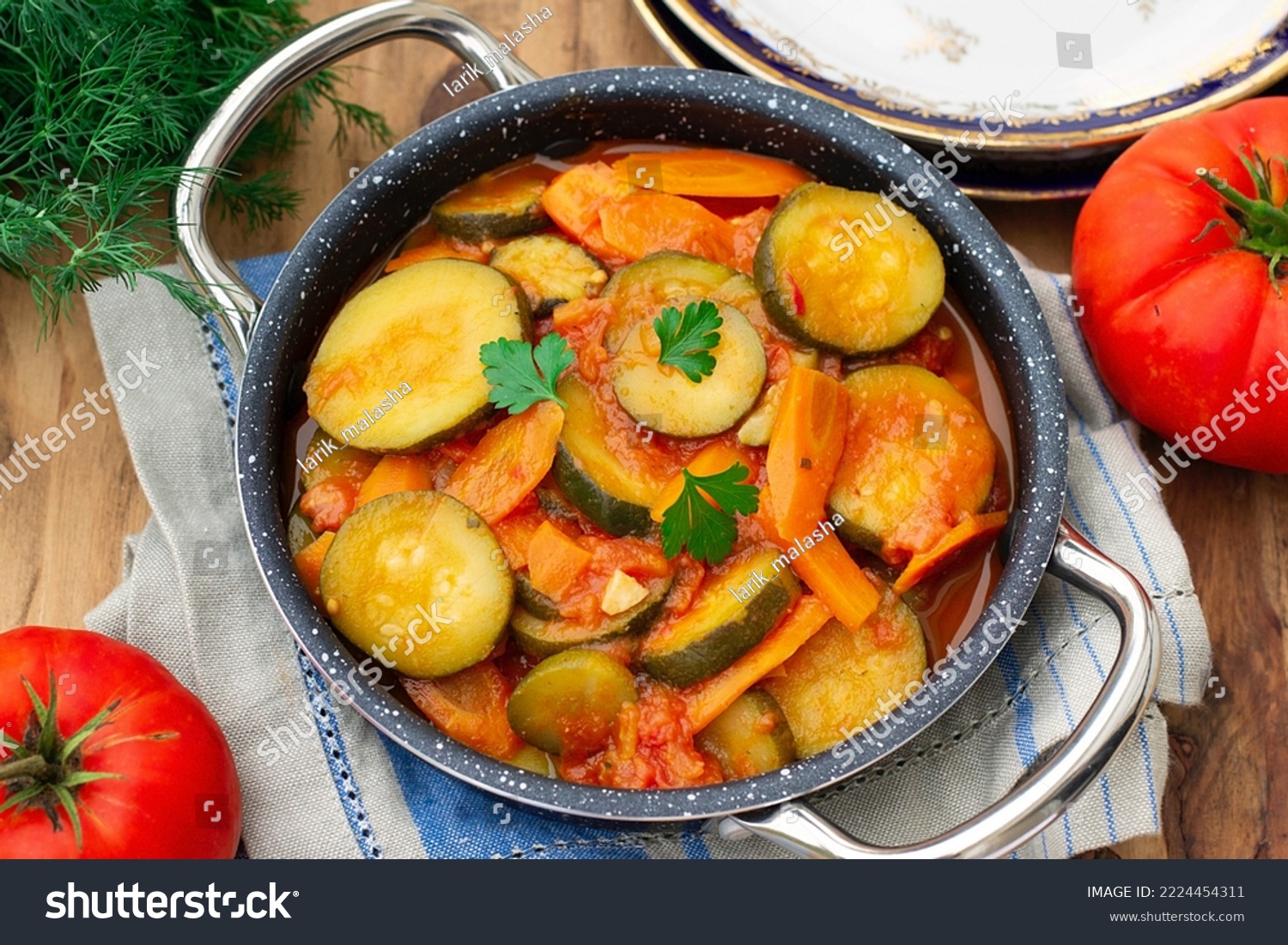 Vegetarian zucchini stew with carrots, garlic and tomatoes #2224454311