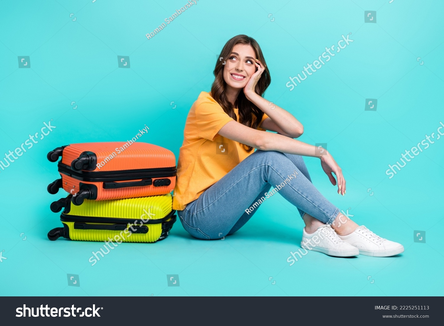 Full length photo of sweet dreamy lady wear yellow t-shirt looking empty space packing suitcases isolated turquoise color background #2225251113