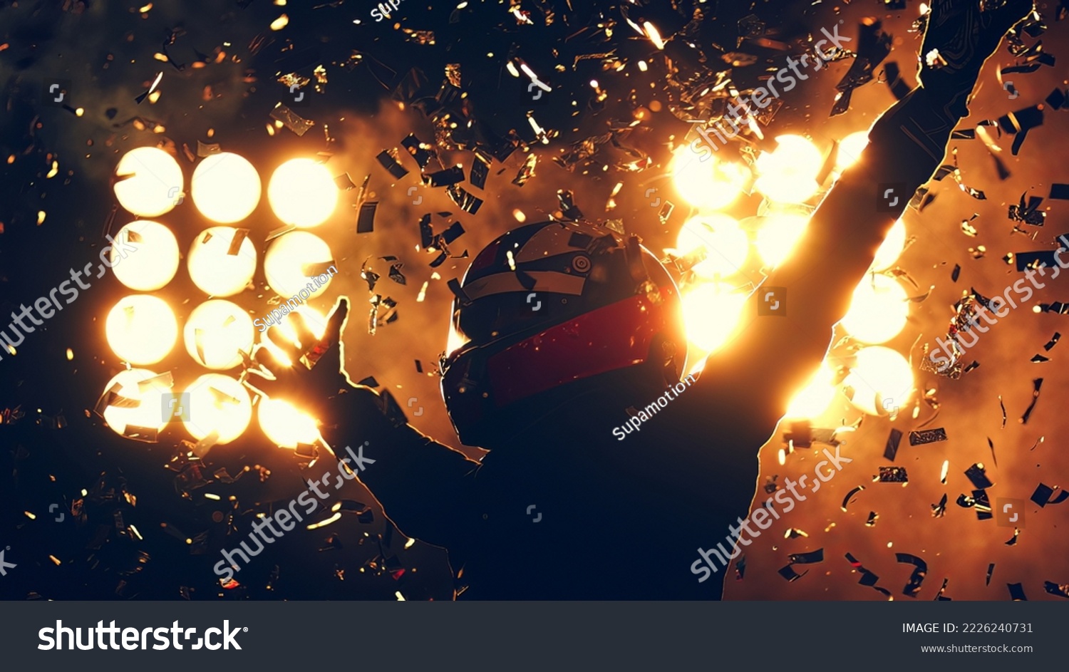 Silhouette of race car driver celebrating the win in a race against bright stadium lights. 100 FPS slow motion shot #2226240731