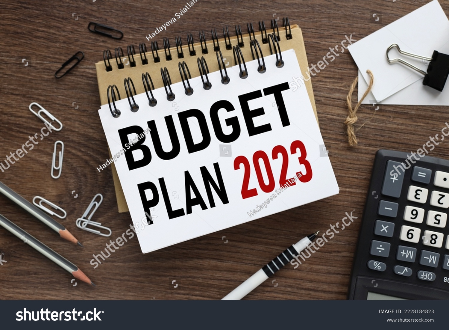 Business concept of planning 2023. top view of work desk and text on open notepad. New year business plan concept in 2023. Economy and business. BUDGET PLAN 2023 #2228184823