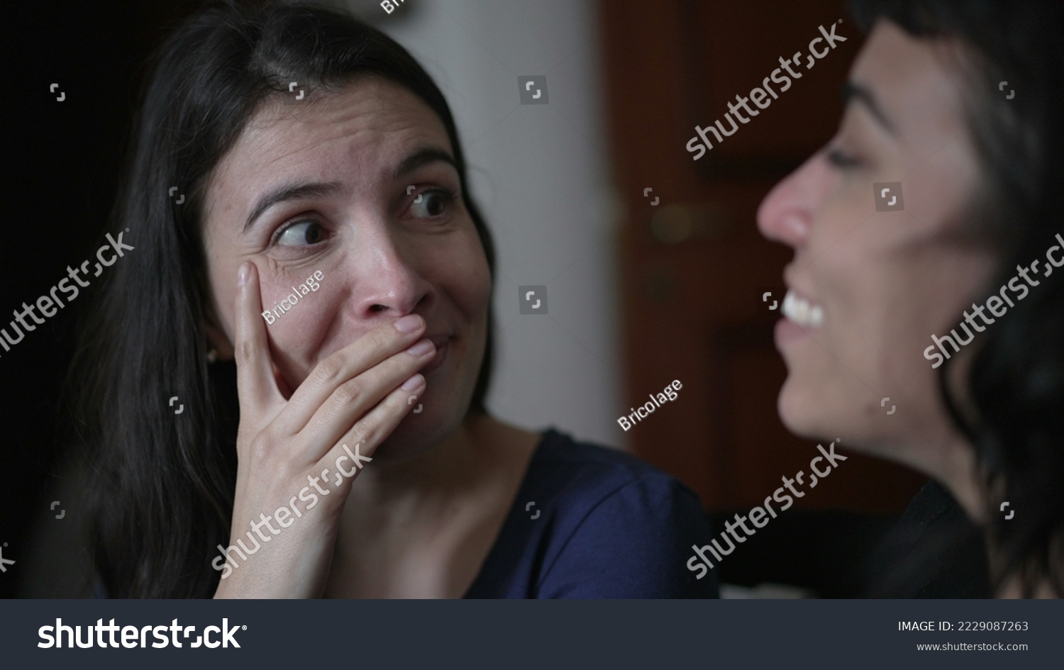 Woman reacting with surprise and unbelief to news told by friend. Person closeup face emotional reaction with consternation #2229087263