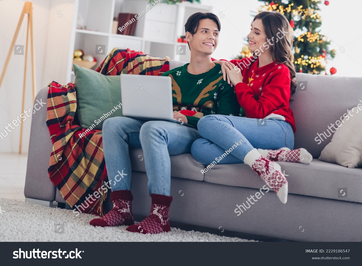 Photo of attractive sweet family husband wife wear ugly jumpers socks relax rest comfy couch enjoining magic season indoors room house #2229186547
