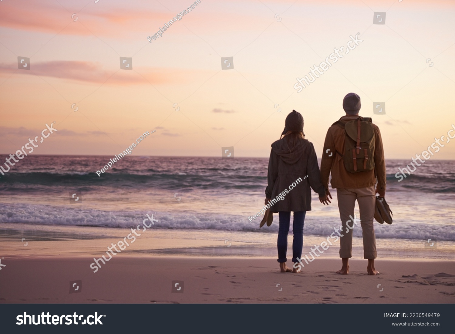 Life is perfect when Im with you. Shot of a couple enjoying a romantic evening on the beach at sunset. #2230549479