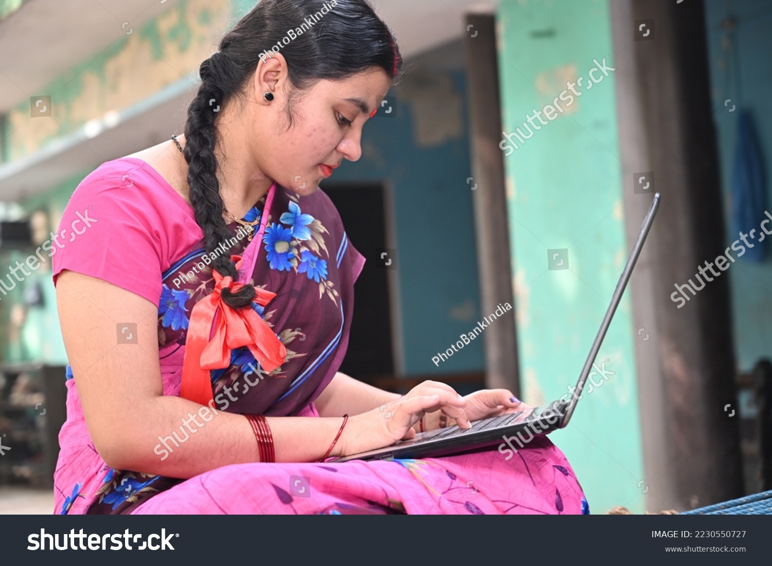 An Indian married woman using laptop  #2230550727