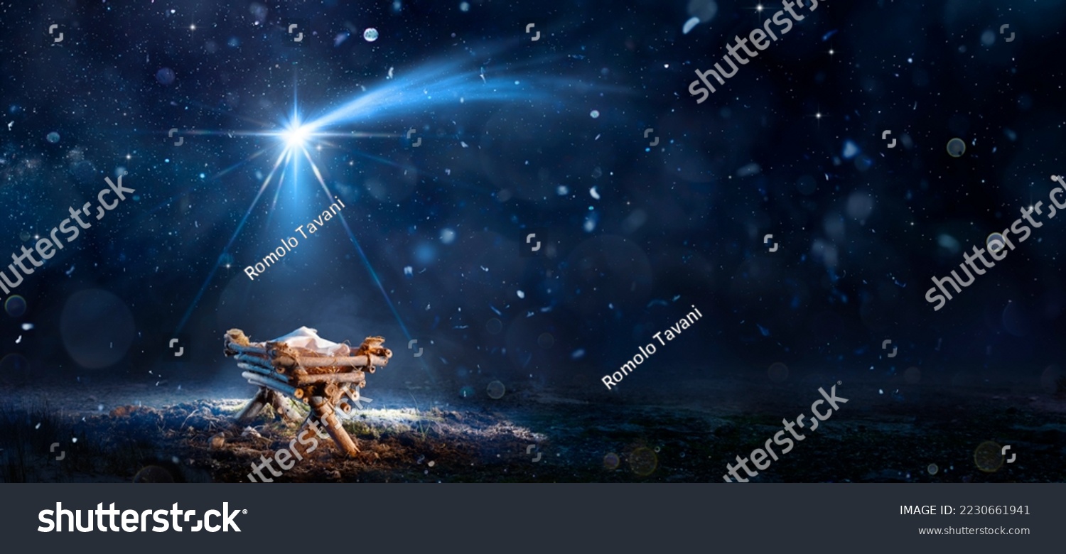 Nativity Scene - Birth Of Jesus Christ With Manger In Snowy Night And Starry Sky - Abstract Defocused Background #2230661941