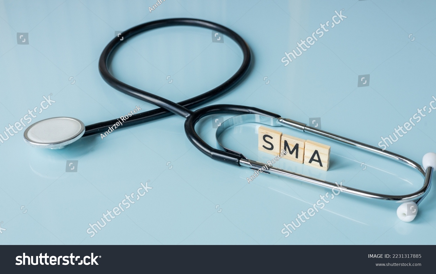 SMA, spinal muscular atrophy, Written on wooden blocks, a rare disease in which, due to a genetic defect, neurons in the spinal cord responsible for muscle contraction and relaxation gradually die #2231317885