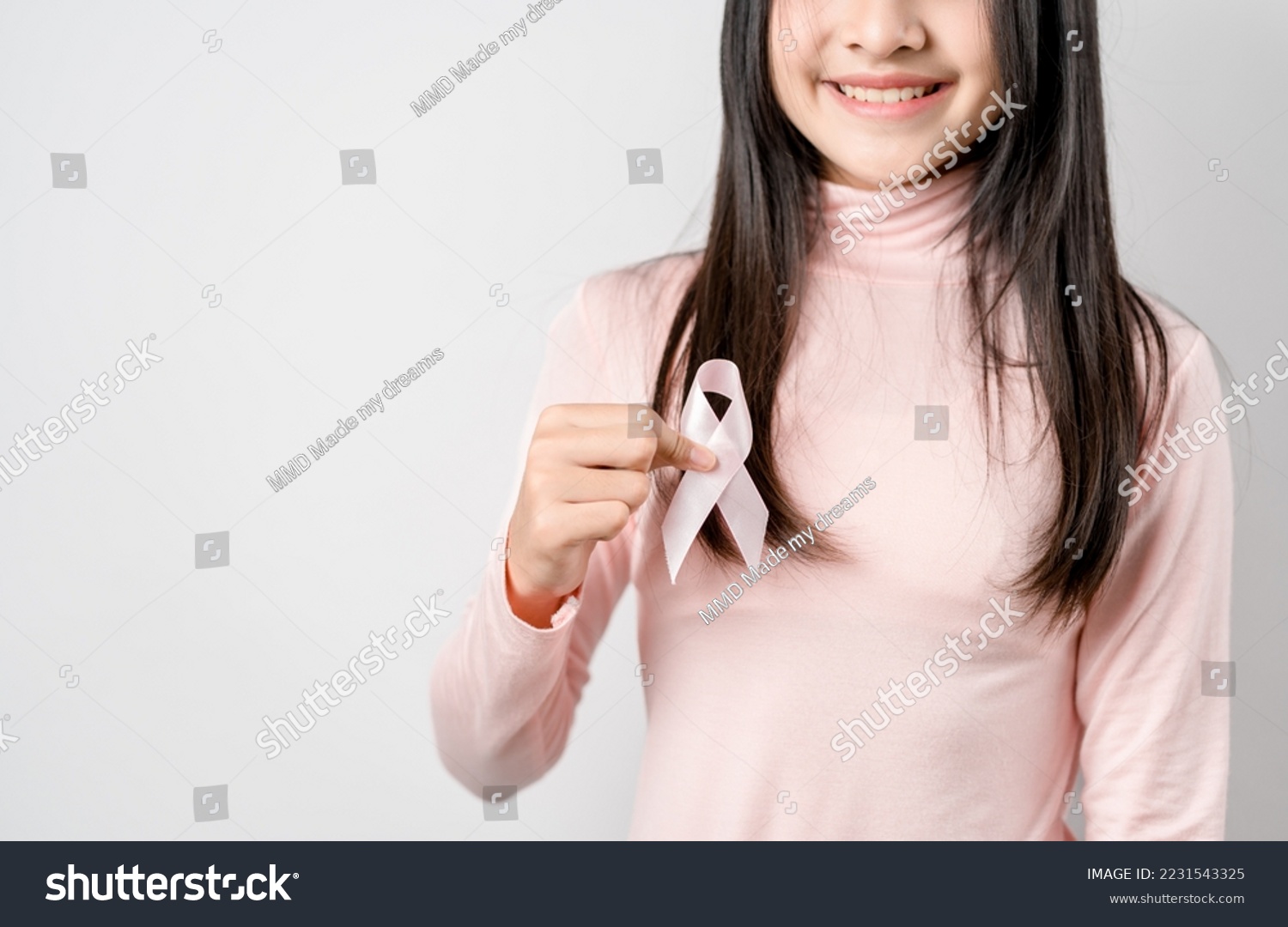 woman hands holding pink ribbon, Breast cancer awareness, world cancer day, national cancer survivor day in february concept.	 #2231543325