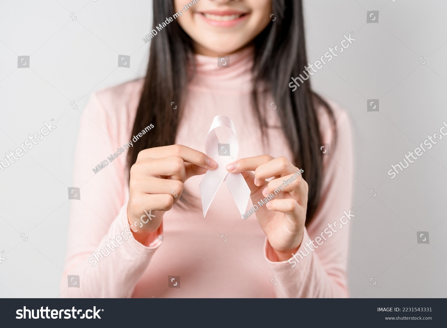 woman hands holding pink ribbon, Breast cancer awareness, world cancer day, national cancer survivor day in february concept.	 #2231543331