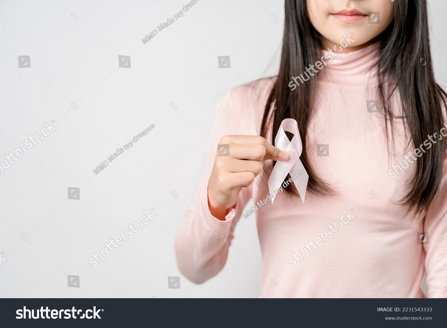 woman hands holding pink ribbon, Breast cancer awareness, world cancer day, national cancer survivor day in february concept.	 #2231543333