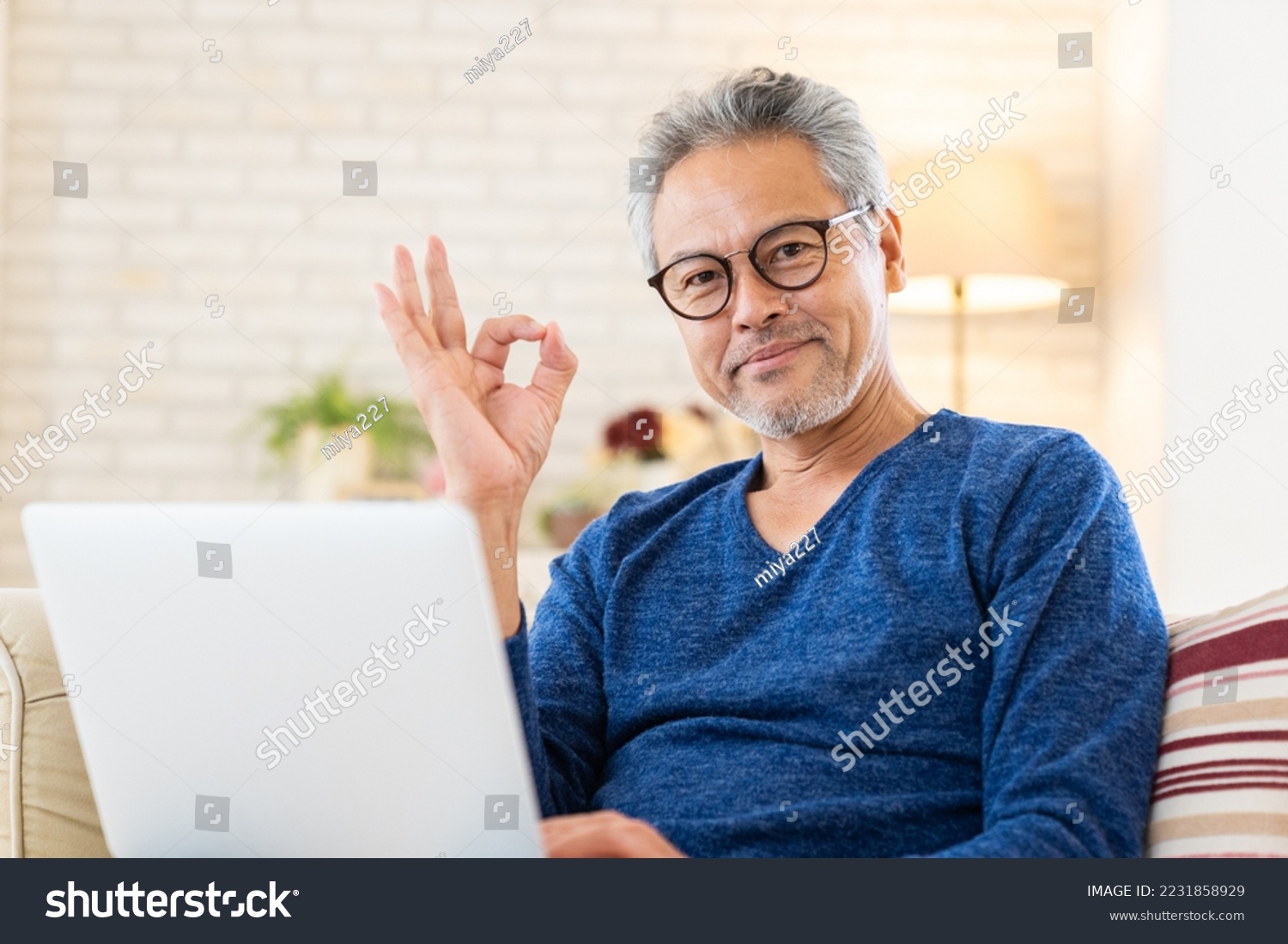 Asian elderly man using laptop #2231858929