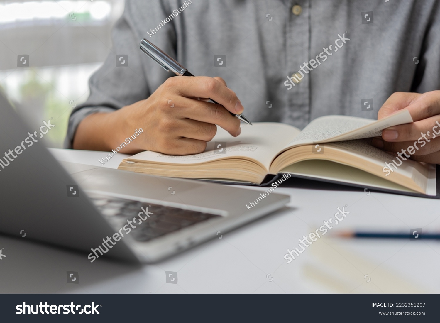 learning online class by using laptop computer and writing notebook at workplace, Education development or knowledge improvement concept. #2232351207