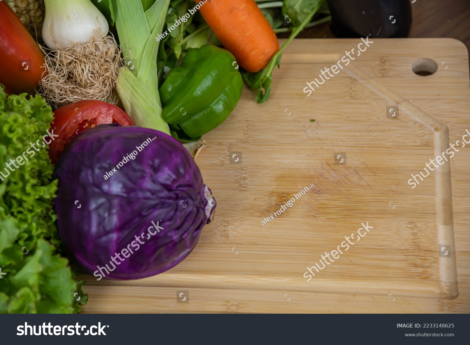 Vegetables on a chopping board. Ingredients for salads. Natural food. Vegetables for human use and consumption. Healthy eating. Vegetables and salads. #2233148625