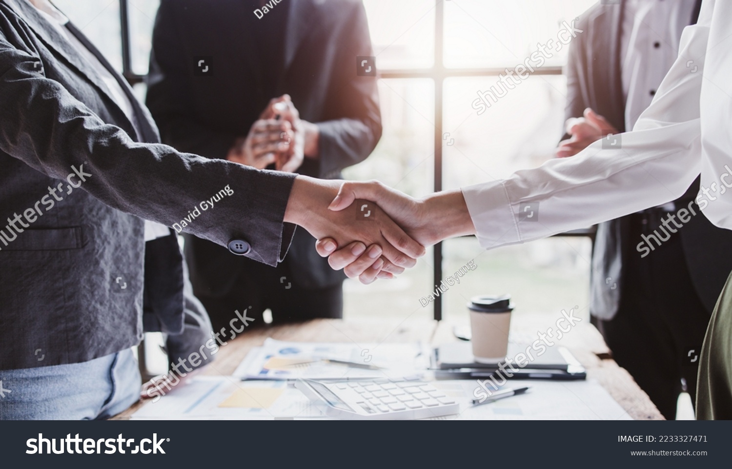 Business handshake for teamwork of business merger and acquisition,successful negotiate,hand shake,two businessman shake hand with partner to celebration partnership and business deal concept #2233327471