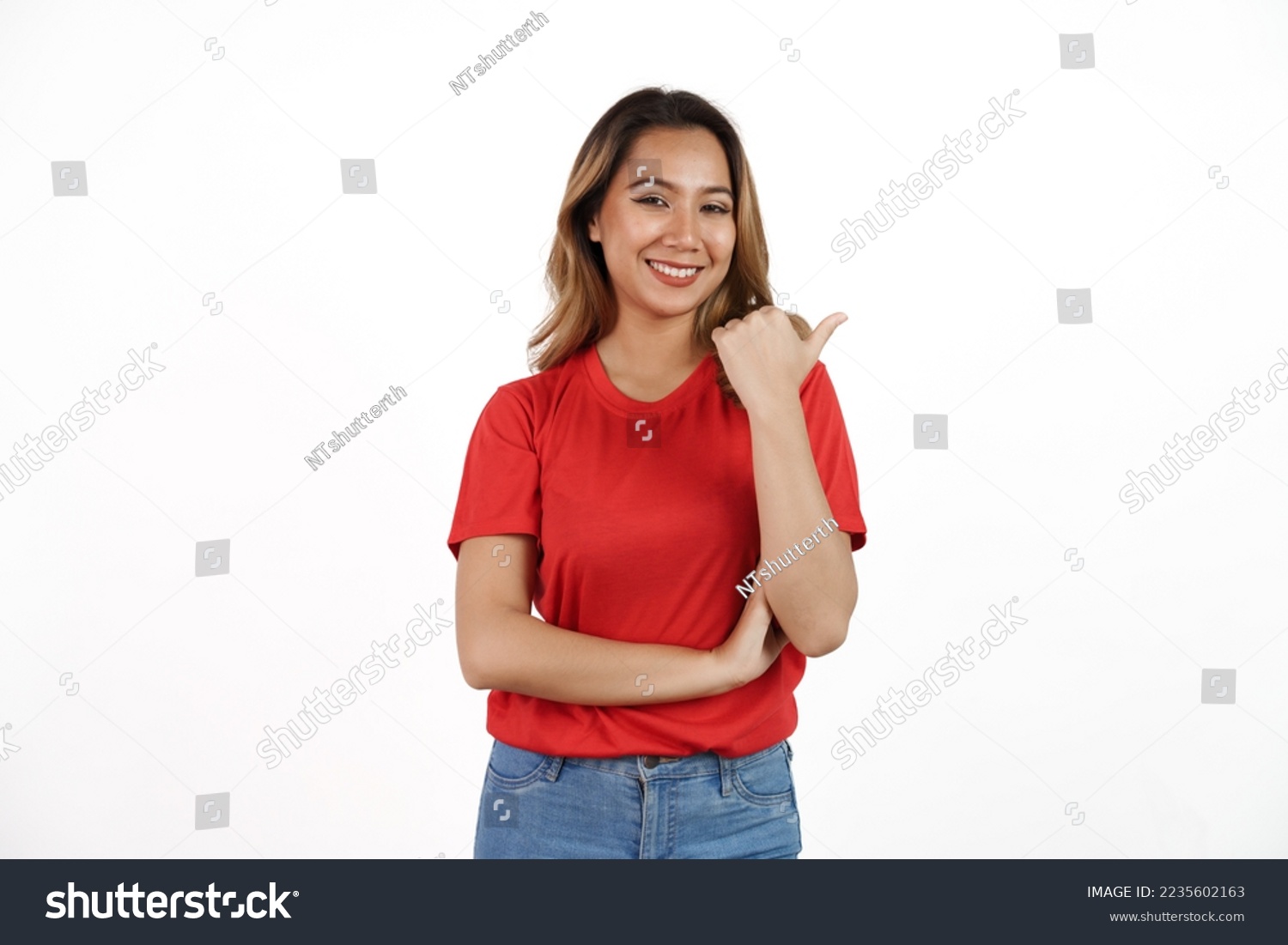 Studio shot of pretty Asian woman with red t-shirt isolated on white background. Pointing blank area #2235602163
