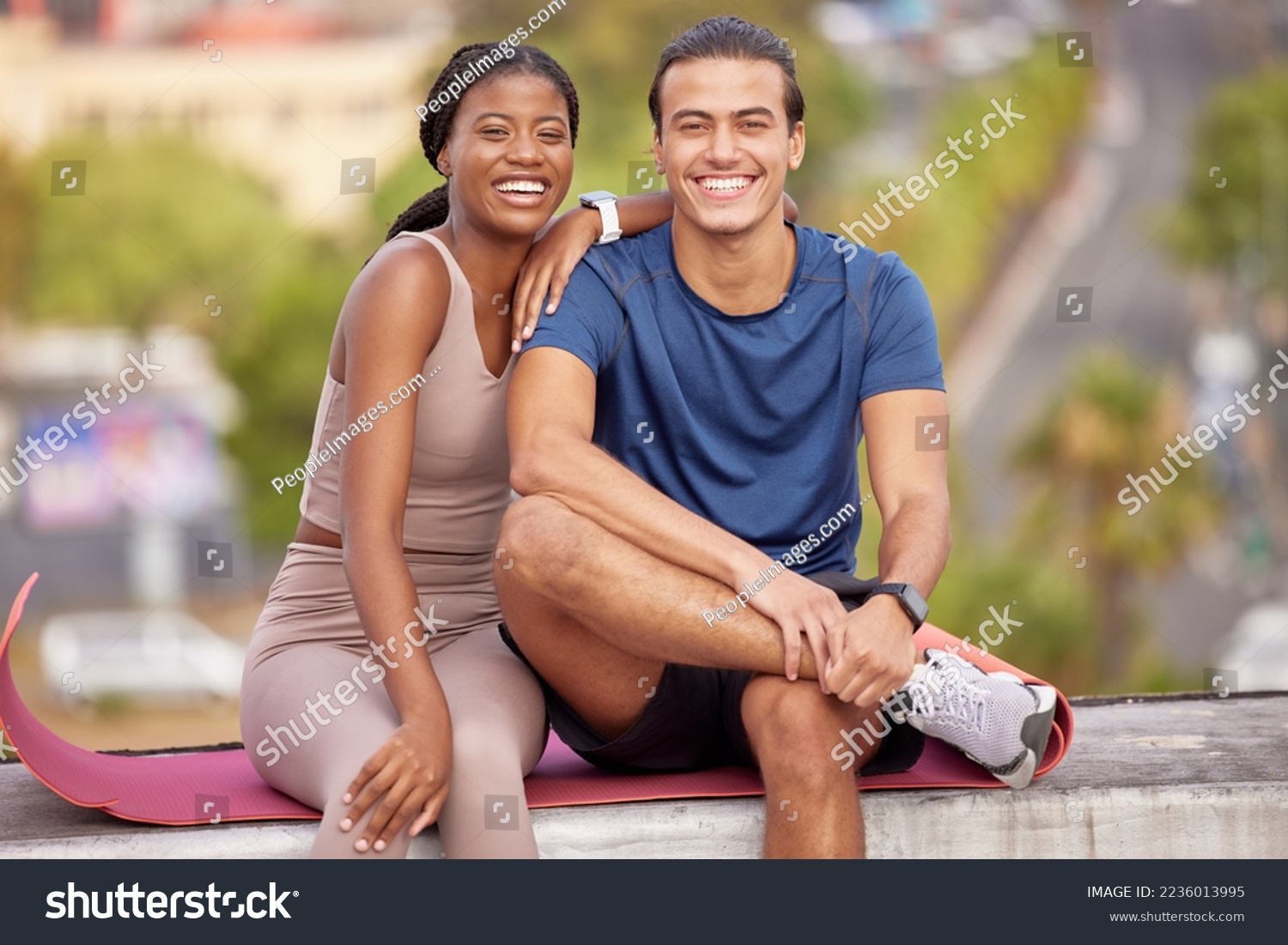 Fitness, yoga and portrait of couple in city on break after stretching, training or workout. Love, interracial couple and man and woman sitting outdoors on mat after pilates exercise for wellness. #2236013995