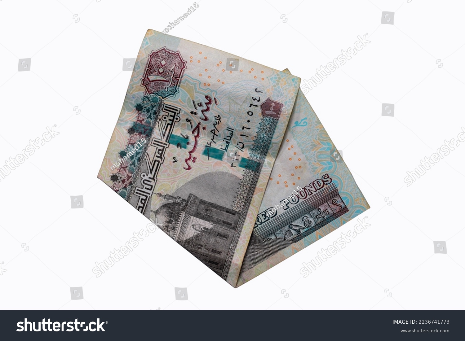 One hundred Egyptian pounds. Twisted on the white background of the Egyptian coin
 #2236741773