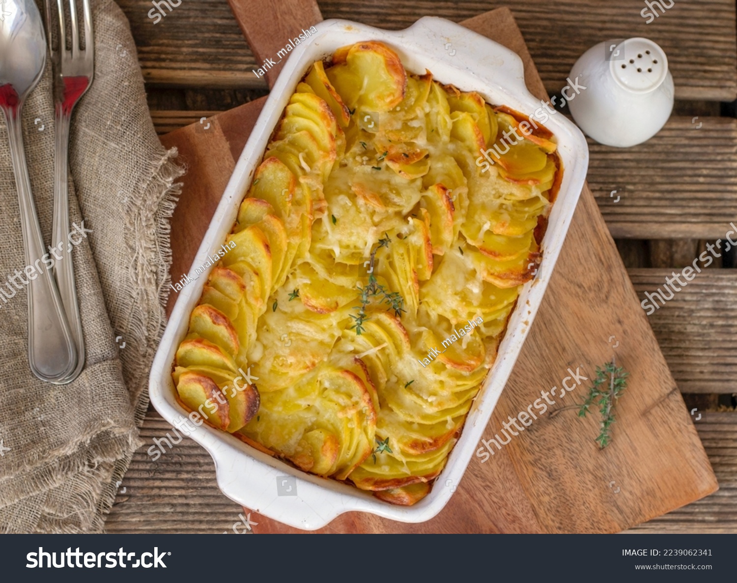 Sliced potatoes baked in cream and cheese Gratin dauphinois #2239062341