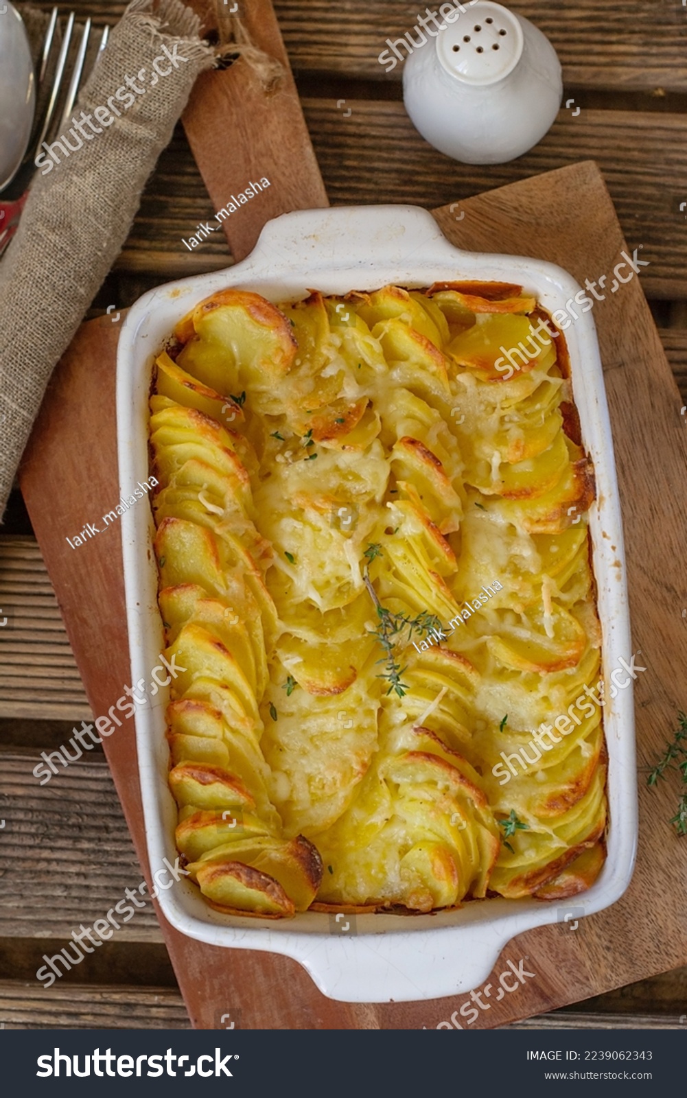Sliced potatoes baked in cream and cheese Gratin dauphinois #2239062343