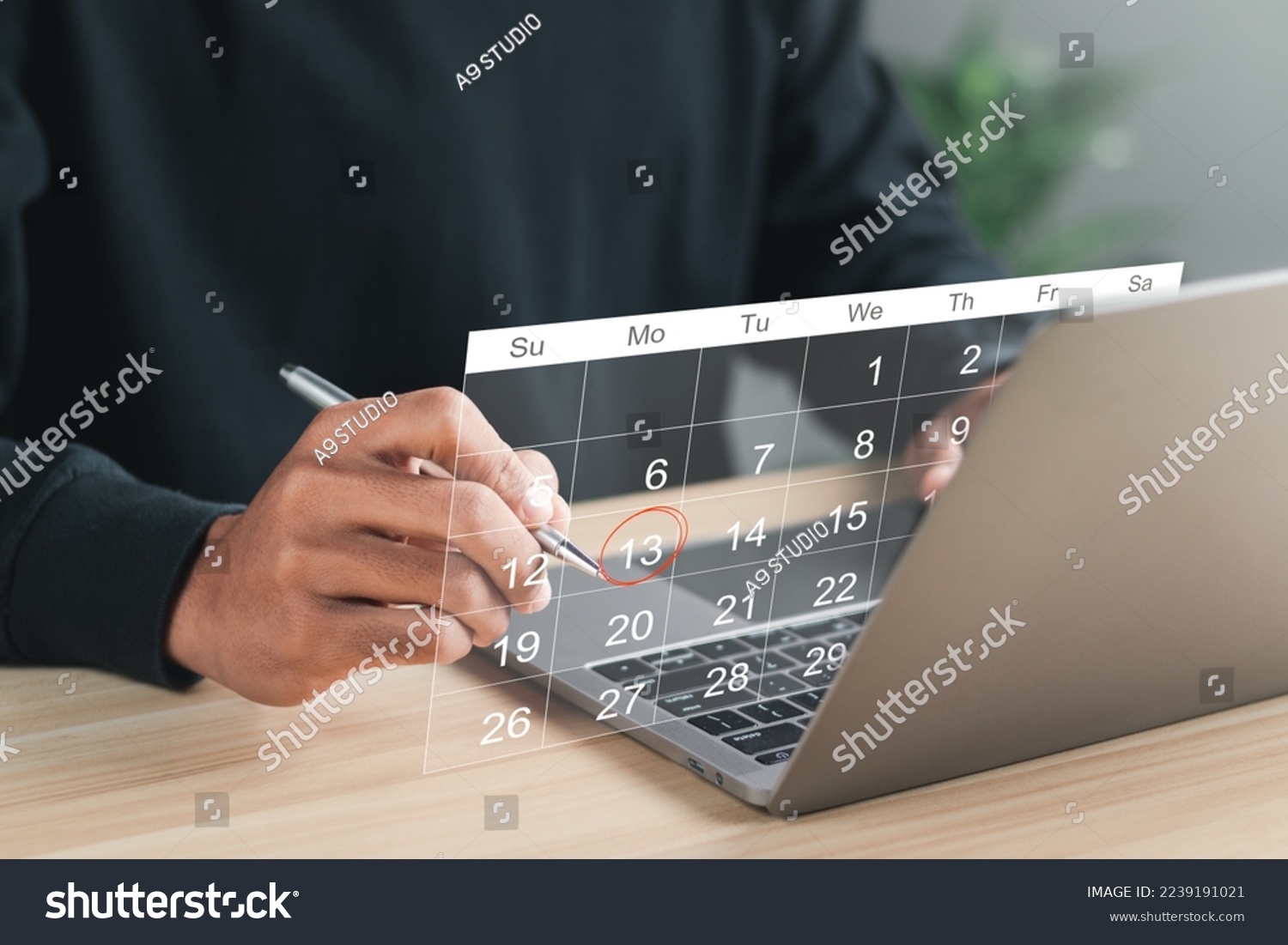 Businessman manages time for effective work. Calendar on the virtual screen interface. Highlight appointment reminders and meeting agenda on the calendar. Time management concept. #2239191021