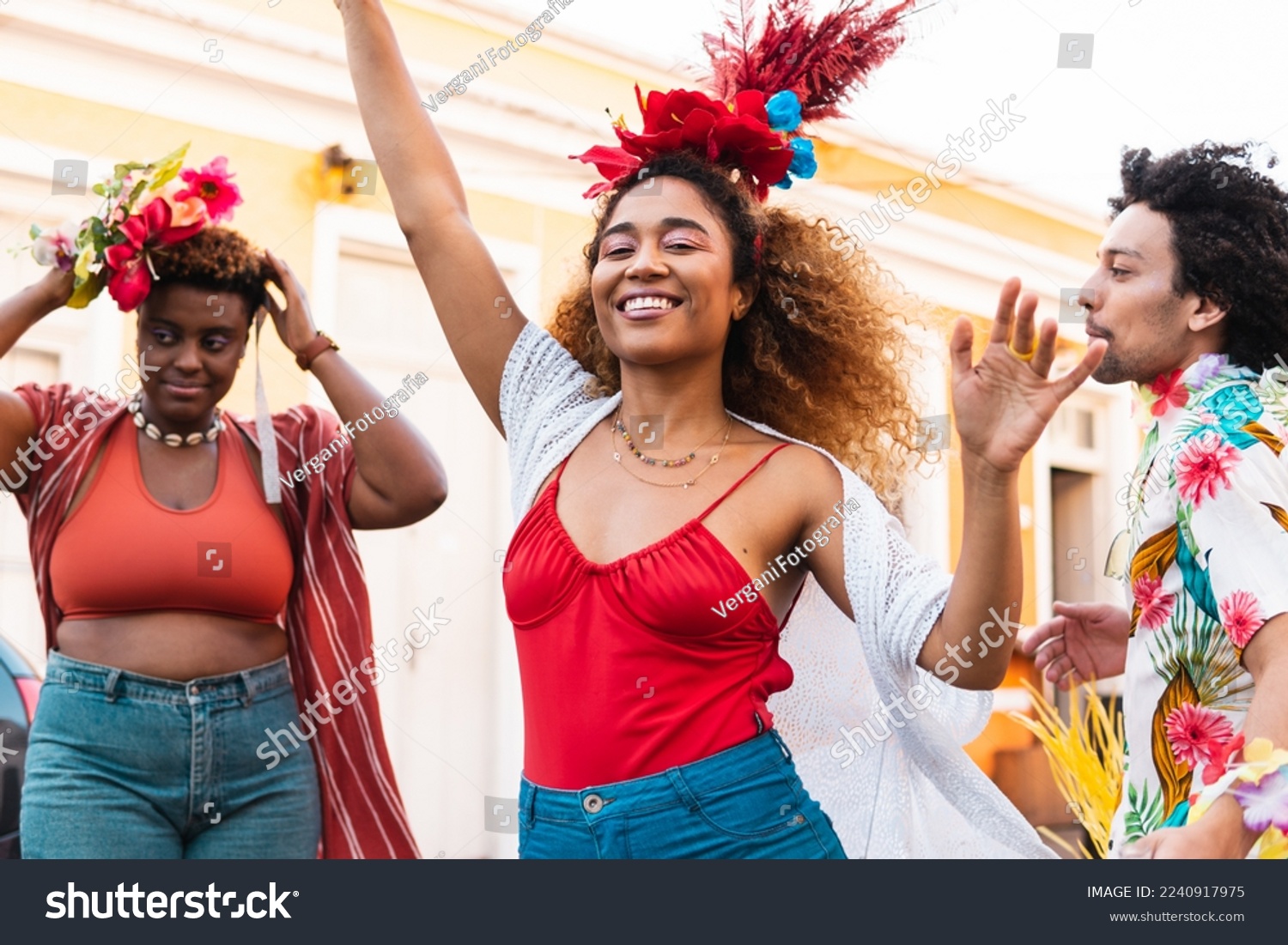 Fun woman dancing Carnival in the street. Brazilian people enjoying Carnaval festival in Brazil #2240917975
