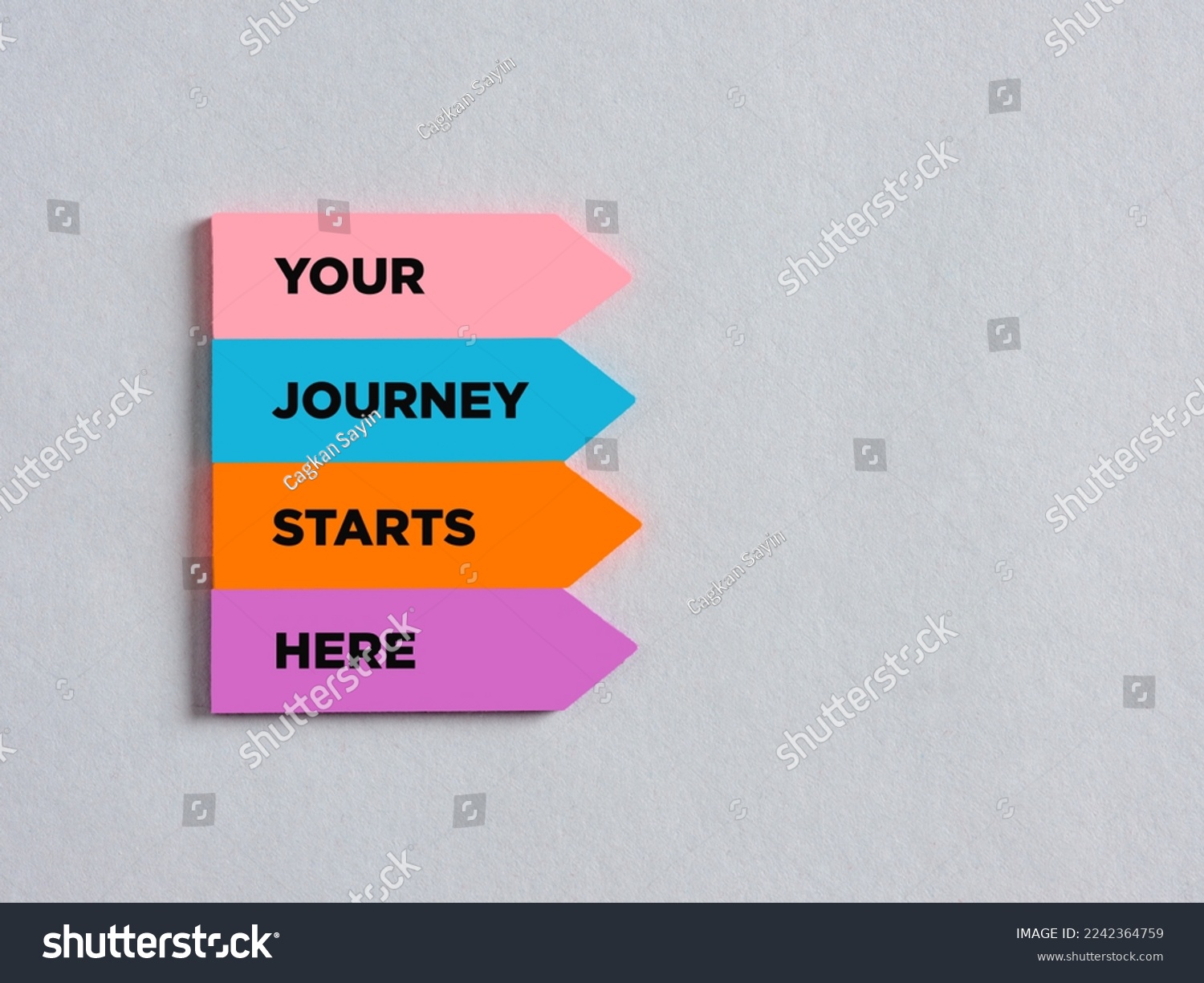 Colorful arrow shaped stickers with the message your journey starts here. Business career or lifestyle motivational message. #2242364759