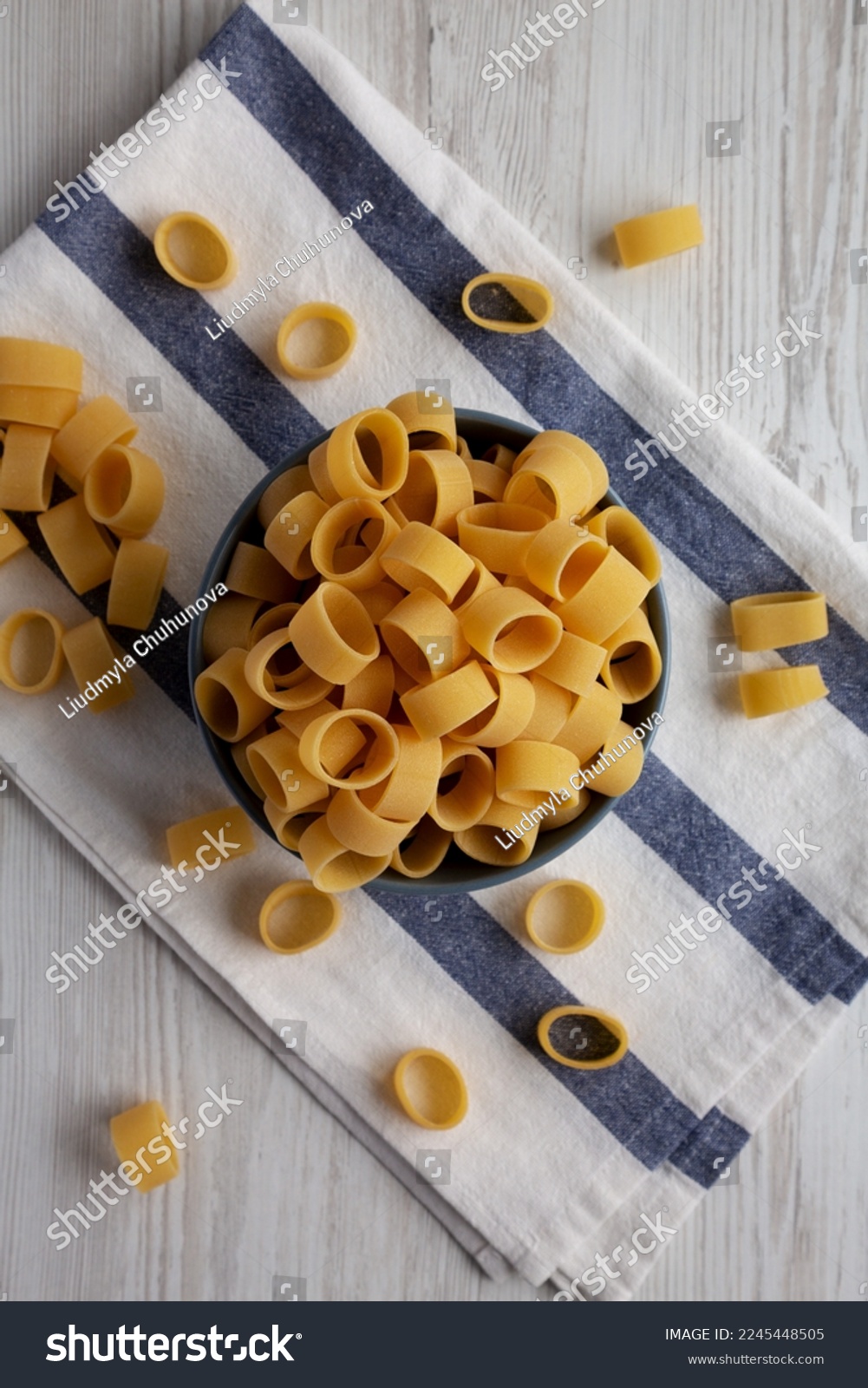 Raw Uncooked Pasta Calamarata in a Bowl, top view. Flat lay, overhead, from above. #2245448505