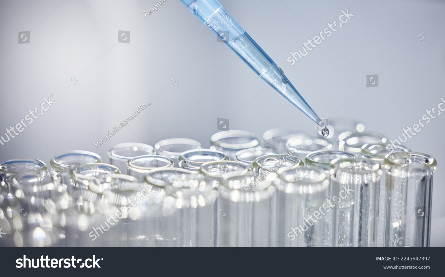 Science, test tubes and syringe for research, experiment or project in chemistry laboratory. Glass vials, innovation and chemical liquid for scientific innovation or analysis in a pharmaceutical lab. #2245647397