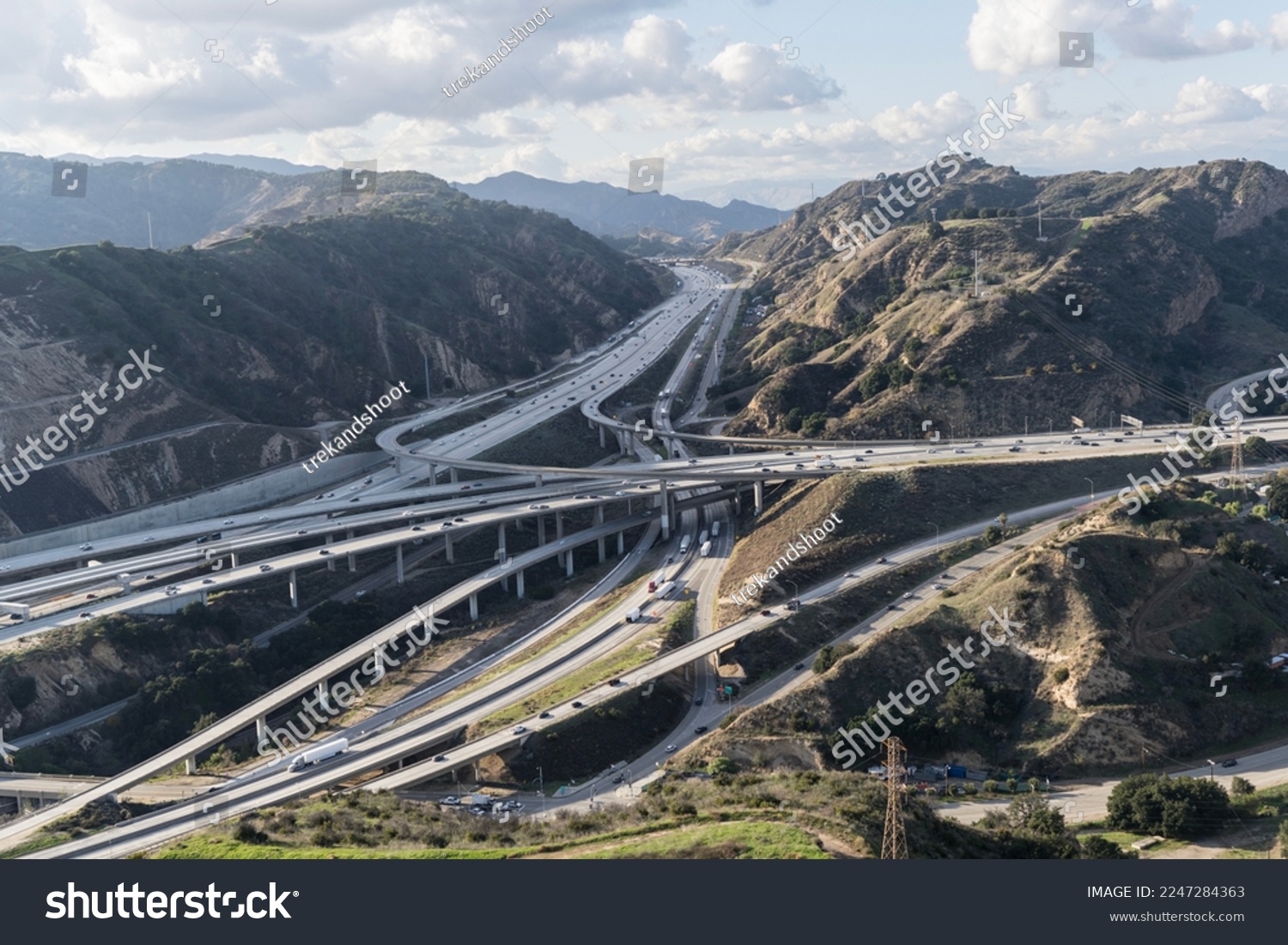 Aerial view of the Golden State 5 and Antelope Valley 14 freeways in the Newhall Pass between Los Angeles and Santa Clarita in Southern California. #2247284363