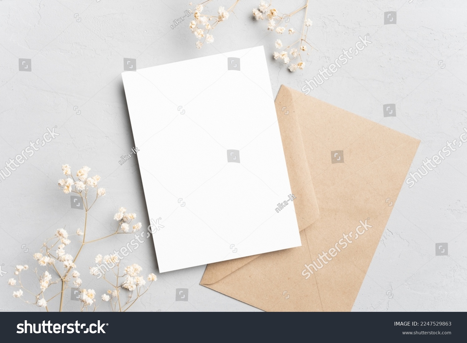 Blank invitation or greeting card mockup with flowers and envelope, wedding card flat lay #2247529863