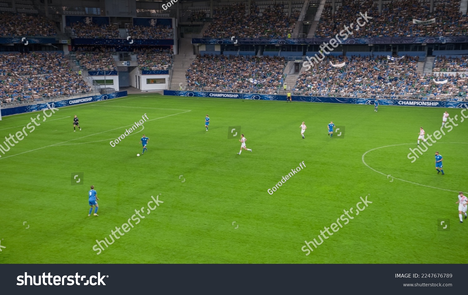 Soccer Football Championship Stadium with Crowd of Fans: Blue Team Forward Attacks, Dribbles, Players Defending The Goals, Ready To Counterattack. Sport Channel Broadcast Television. High Angle Wide. #2247676789