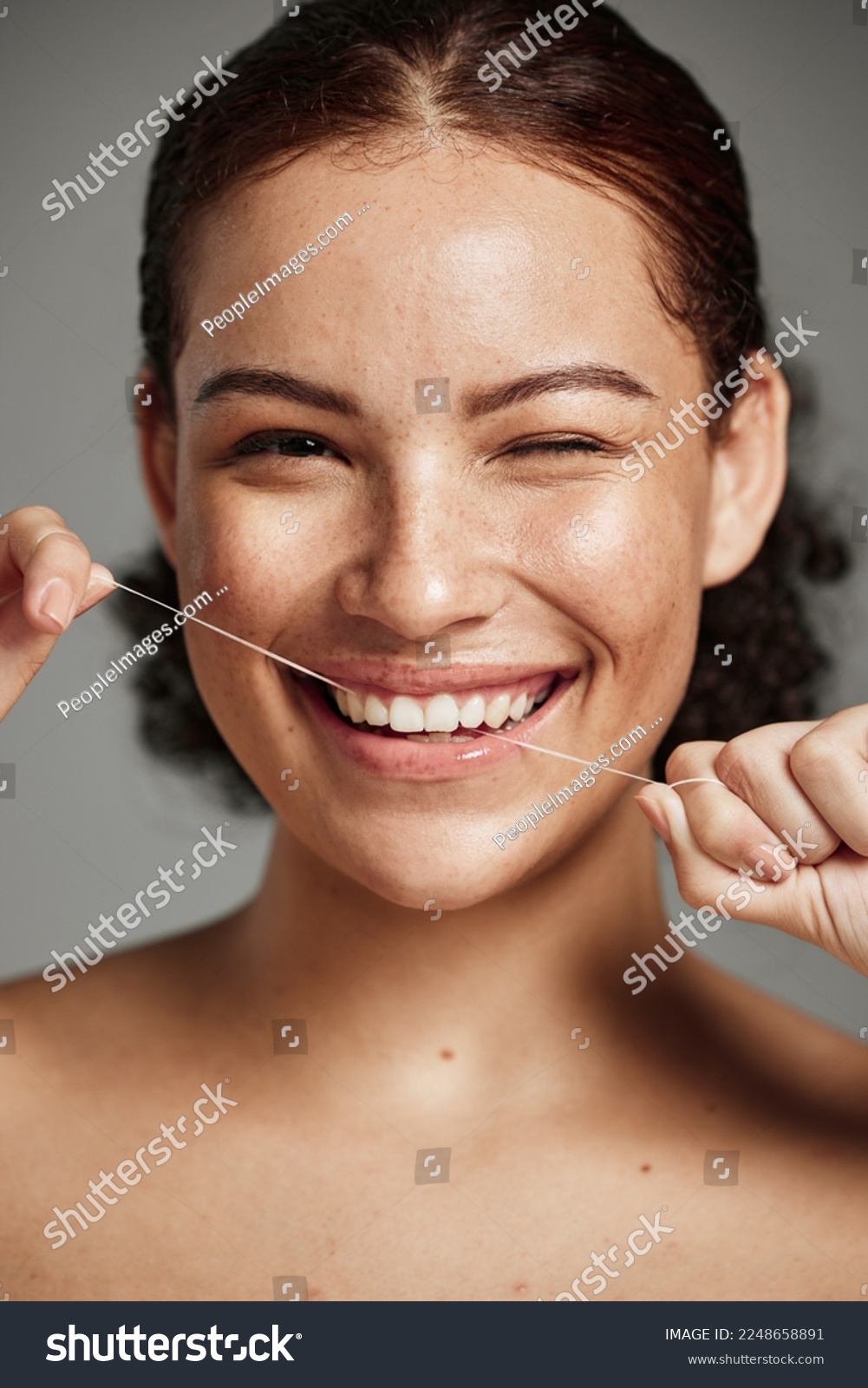 Teeth flossing, dental floss and portrait of woman with a smile in studio for oral hygiene, health and wellness. Face of happy female on grey for self care, healthcare and grooming for healthy mouth #2248658891