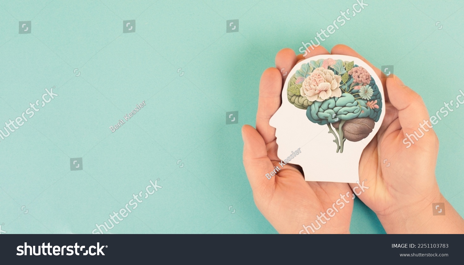 Hands holding paper head, human brain with flowers, self care and mental health concept, positive thinking #2251103783