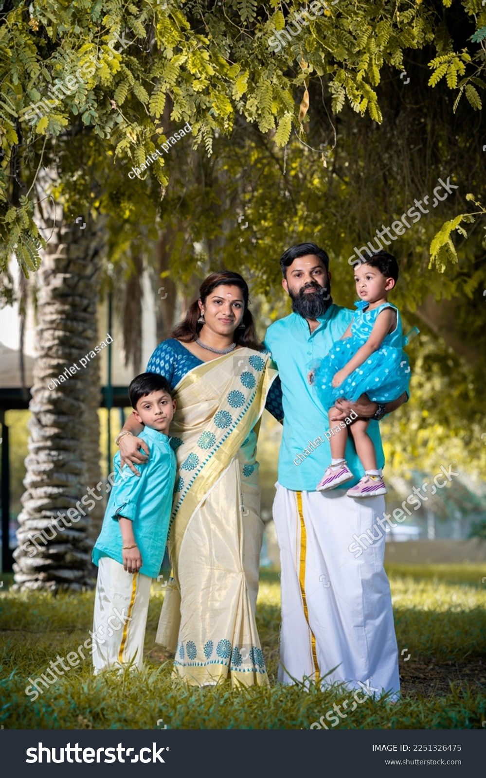couple with children onam dress saree and lungi #2251326475