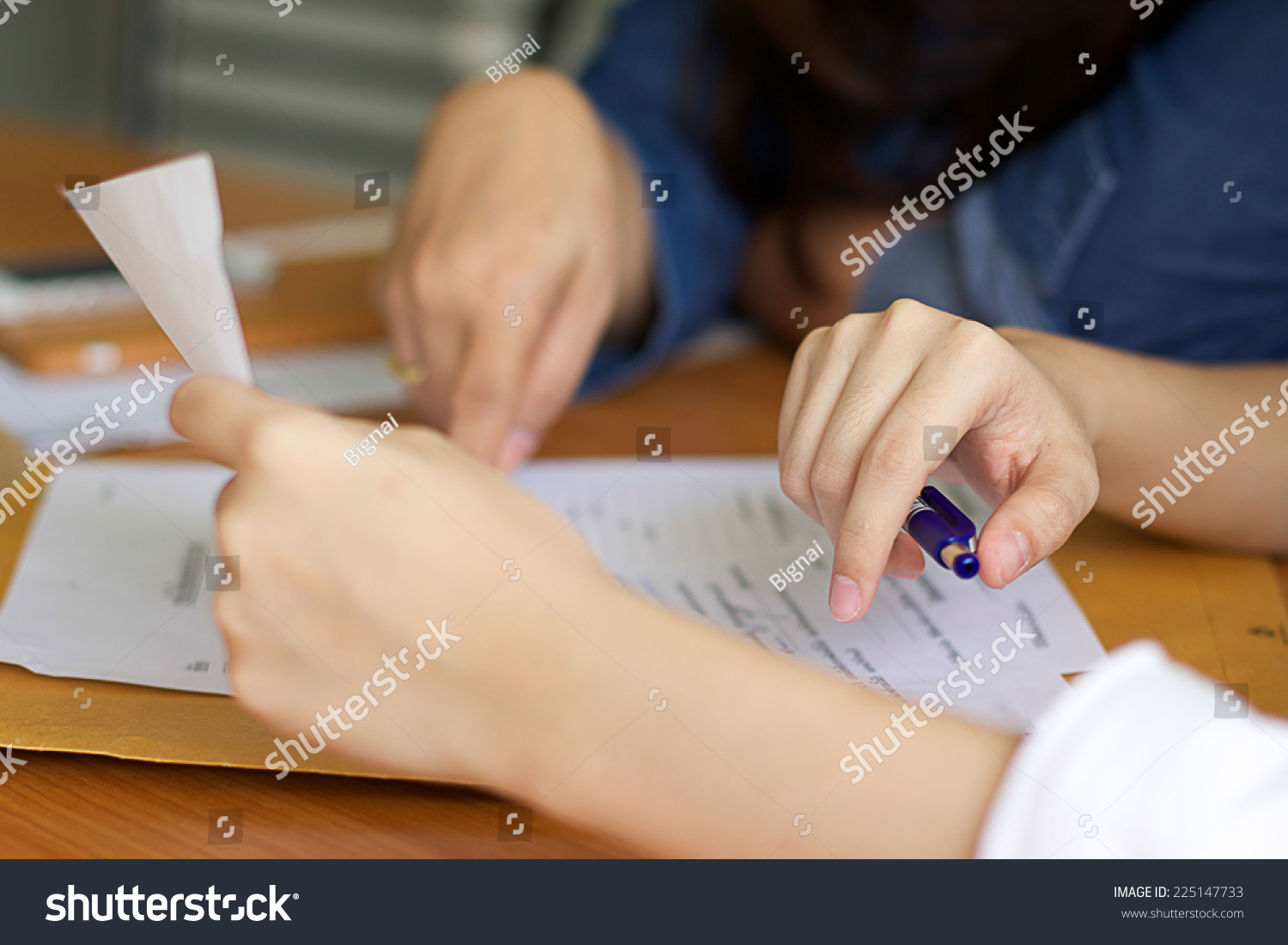 Business woman filling document agreement form in office. #225147733